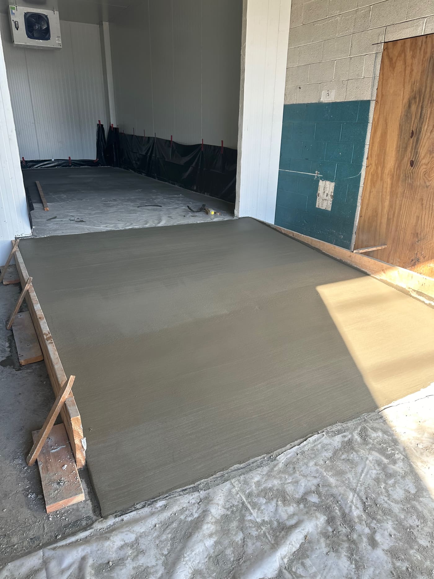 Freshly poured concrete garage slab