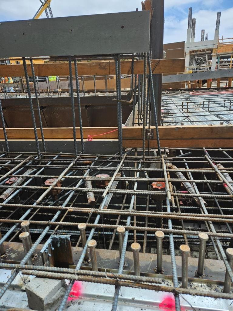 Rebar cage formed for a multi-story building foundation