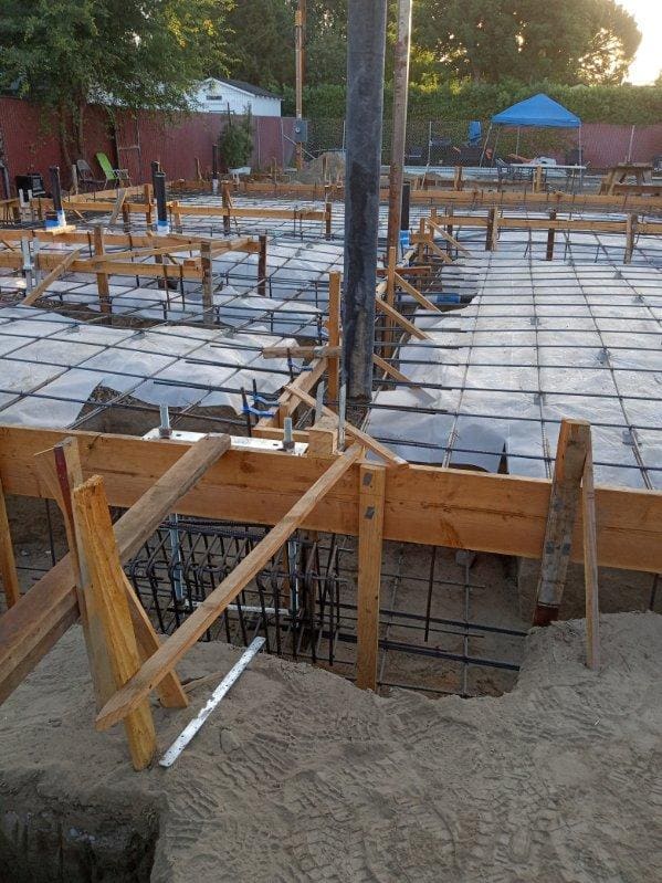 Formed and reinforced foundation footings ready for pour