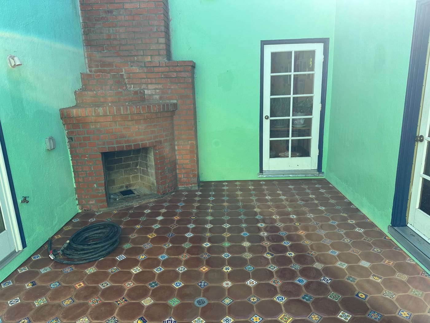 Brick fireplace and hearth in a renovated room