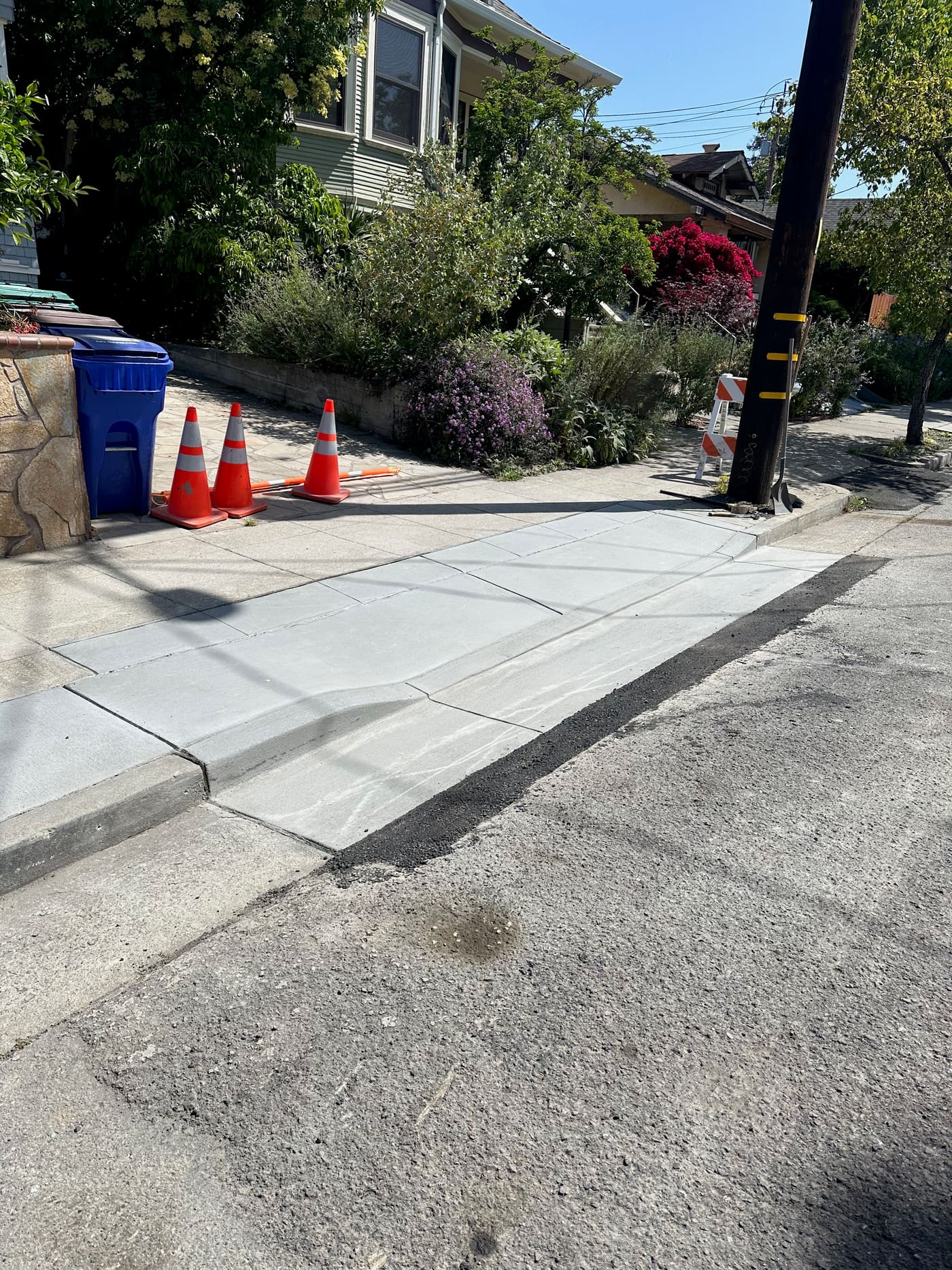 New concrete sidewalk and curb section poured to city spec