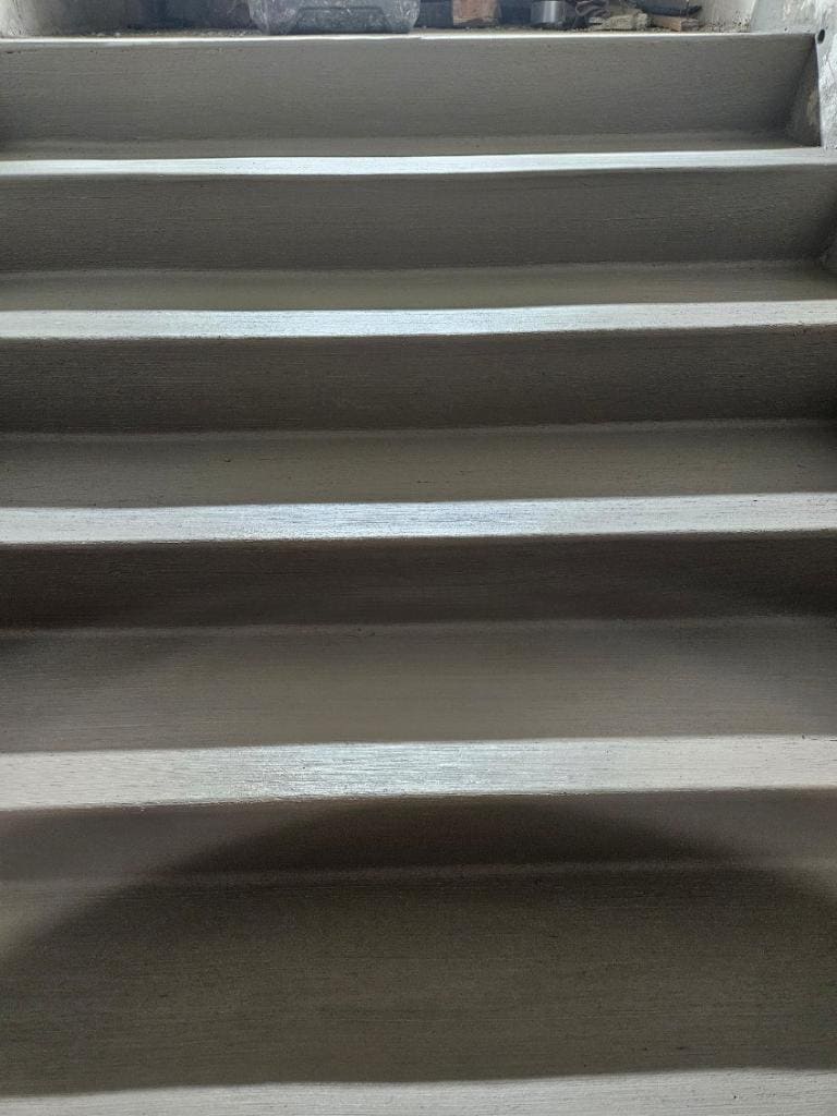 Board-form textured concrete stair treads